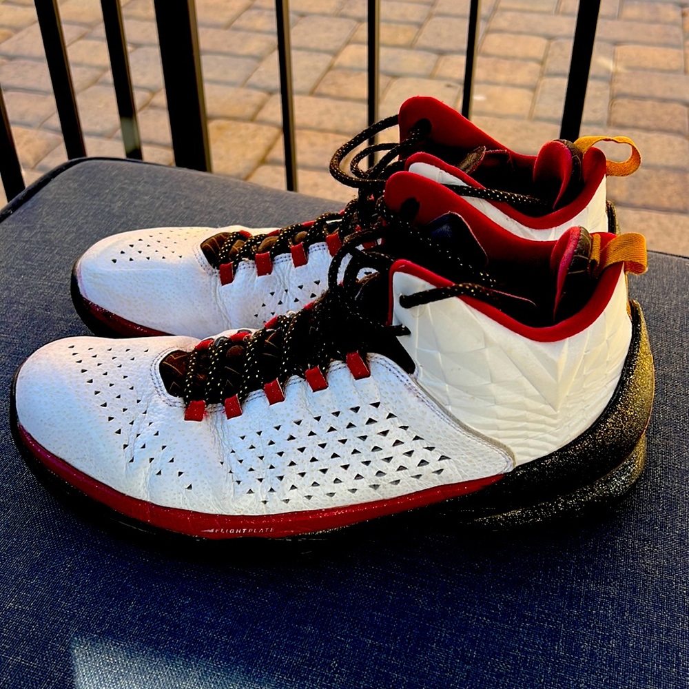 Jordan Melo M11 — red, white, & black. Gently used. Perfect for outdoor hoopers.